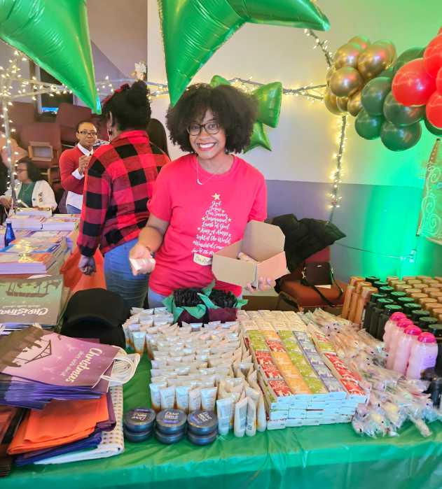 An Elf helped to wrap gifts at the Friday, Dec. 5, 2025 Christmas Village celebration at Liberty Bible Fellowship Church, to be delivered by Santa. The gifts will put smiles on the faces of residents of senior citizens homes in the community.