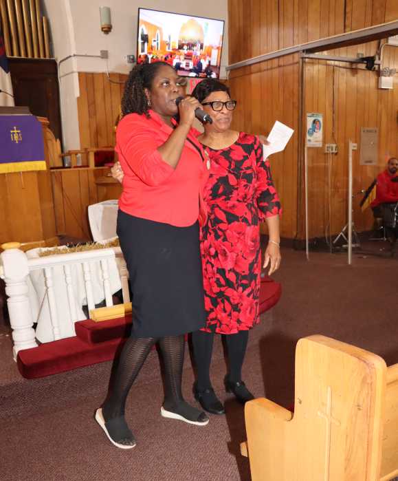 Sunday School Superintendent Gail Murray, left, with Joycelyn King, gives acknowledgements.