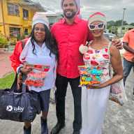 President of the Guyana America Heritage Foundation USA, Lady Ira Lewis, Minister of Culture, Youth and Sports Charles S. Ramson, and Caribbean Life's contributor Tangerine Clarke, during a Dec. 21, toy giveaway in Agricola Village, on the East Coast of Demerara, Guyana.