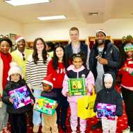 From left, Immigration Attorney Melnia Cordis, host of the Reset Talk Show, JR Giddings, family, Maria Weigand, Mrs. Sharon Weigand, Audiologist, SUNY Downstate Hospital, John Weigand, Public Advocate Jumaane Willliams, volunteer Claire Patterson-Monah, and children with their toys, at the 2nd Annual toy giveaway, hosted by the Reset Talk Show, at Reflections Church, on Dec. 13, 2025.
