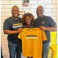 Karine Jean-Pierre, center, former Press Secretary for President Joe Biden and first Haitian-American to hold that role, with Rogers Burgers co-founders Jonathan Pierre, left, and Josue Pierre