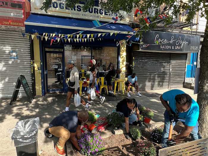 Rogers Burgers' staff proudly beautifying the community this summer.
