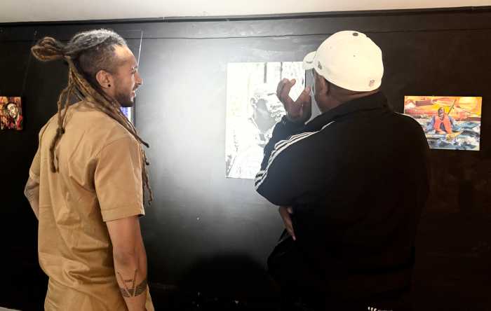 Dario Mohr, founder of AnkhLave Arts Alliance, stands with members of the international artist cohort during the organization’s first major exhibition on the African continent.