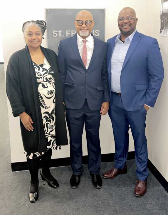 From left, Rona Taylor, president of the Shirley Chisholm Democratic Club, Civil Court Judge Chidi Eze, and Josue Pierre, District Leader.