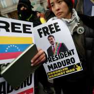 Demonstrators hold placards during a protest against U.S. strikes against Venezuela and the capture of Venezuelan President Nicolas Maduro, outside the Daniel Patrick Moynihan United States Courthouse as he makes an initial appearance to face U.S. federal charges including narco-terrorism, conspiracy, drug trafficking, money laundering and others in New York City, U.S., January 5, 2026.