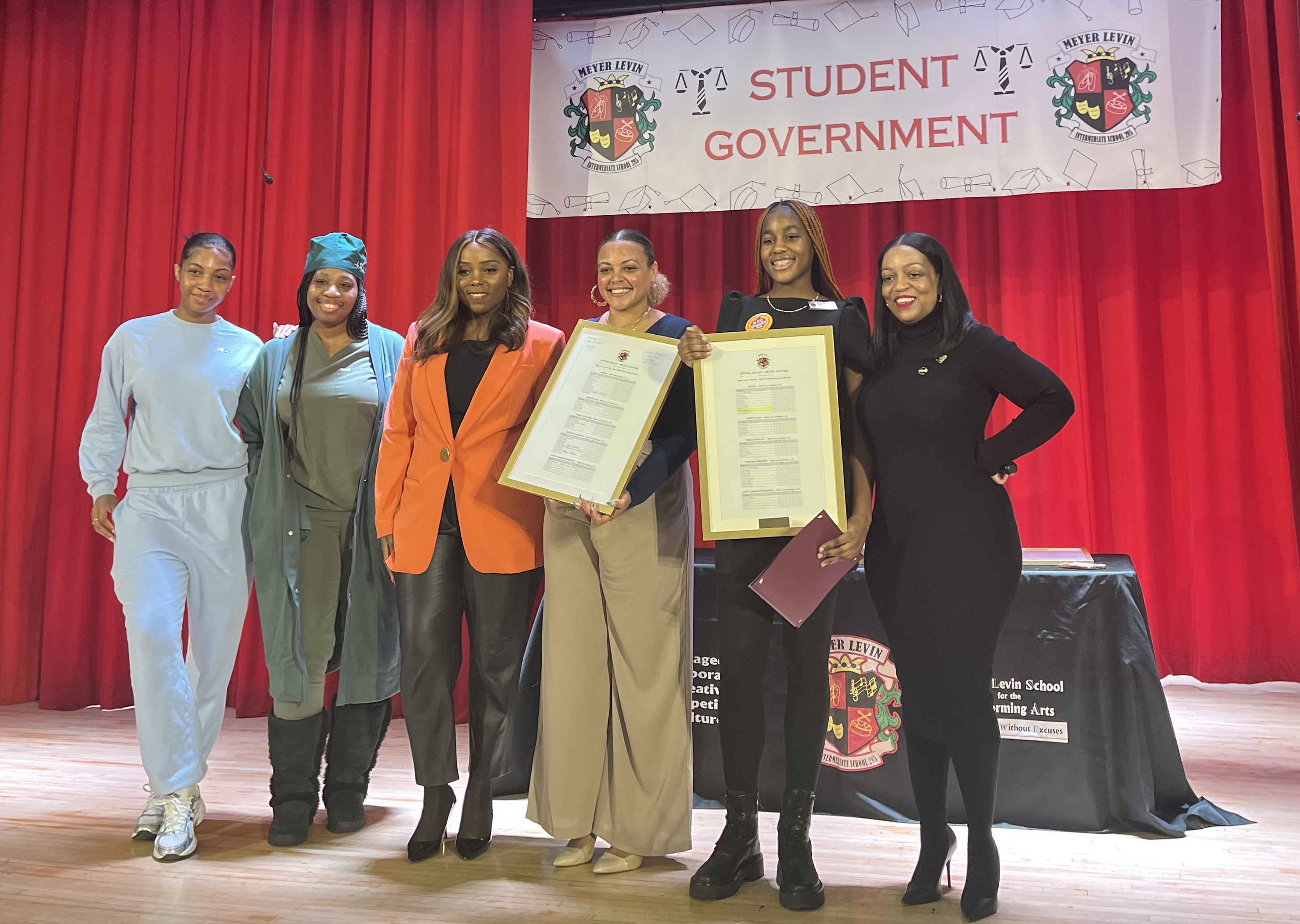 Family memeber of Victoria Mompoint, Victoria’s mother, Council Member Farah Louis, Jahmila Edwards, director of Intergovernmental Affairs for NYC Mayor's Office, student elected mayor, Victoria Mompoint, and school principal, Jamie Hendrickson.