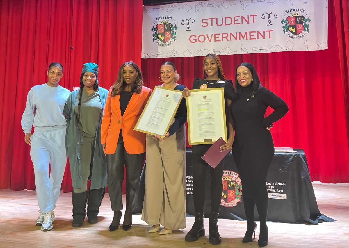 Family memeber of Victoria Mompoint, Victoria’s mother, Council Member Farah Louis, Jahmila Edwards, director of Intergovernmental Affairs for NYC Mayor's Office, student elected mayor, Victoria Mompoint, and school principal, Jamie Hendrickson.