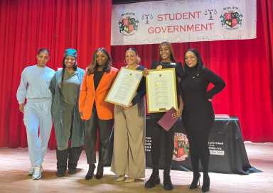 Family memeber of Victoria Mompoint, Victoria’s mother, Council Member Farah Louis, Jahmila Edwards, director of Intergovernmental Affairs for NYC Mayor's Office, student elected mayor, Victoria Mompoint, and school principal, Jamie Hendrickson.