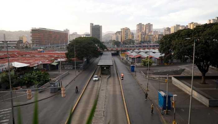 People stand in an empty street, after U.S. President Donald Trump said the U.S. has struck Venezuela and captured its President Nicolas Maduro, in Caracas, Venezuela, January 3, 2026.