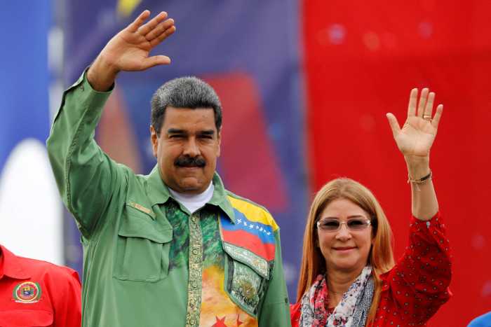 Venezuela's President Nicolas Maduro and his wife Cilia Flores greet supporters during his closing campaign rally in Caracas, Venezuela May 17, 2018.