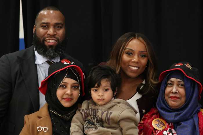 Assembly Member Brian Cunningham with Council Member Farah N Louis, alongside Brooklyn mothers and their children.