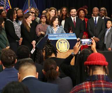 Governor Kathy Hochul speaking on the announcement with myriad state and city elected officials.