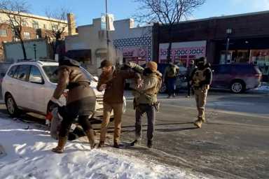 A screengrab from a video obtained by Reuters shows a law enforcement officer spraying irritants at a man identified as Alex Pretti, before he was fatally shot when federal agents were trying to detain him in Minneapolis, January 24, 2026.