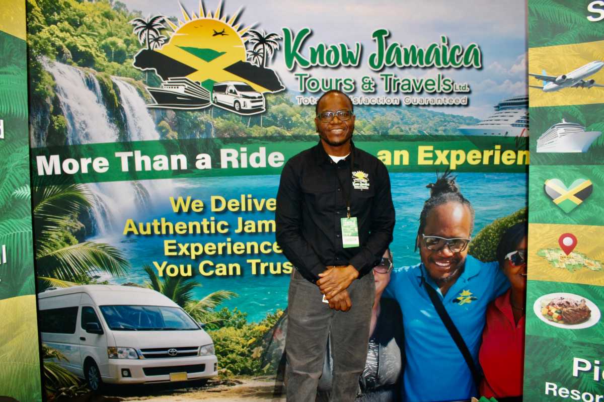 Javia Shaw, against the backdrop of aquamarine water, and happy customers, praised his family company Know Jamaica Tours & Travels for sharing jaunts that represent the rich cultural and history of the island nation. Shaw was one of hundreds of presenters at the 2026 New York Travel & Adventure Show, at the Jacob Javits Center in New York City, on Jan. 24, 2026.