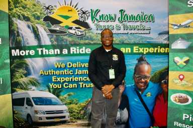 Javia Shaw, against the backdrop of aquamarine water, and happy customers, praised his family company Know Jamaica Tours & Travels for sharing jaunts that represent the rich cultural and history of the island nation. Shaw was one of hundreds of presenters at the 2026 New York Travel & Adventure Show, at the Jacob Javits Center in New York City, on Jan. 24, 2026.