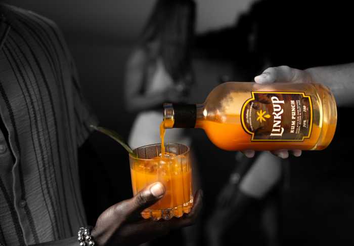 Bottles of LinkUp Rum Punch were showcased at a tasting event, where the Caribbean-inspired cocktail has gained attention for its bold flavor and mindful approach to ready-to-drink spirits.