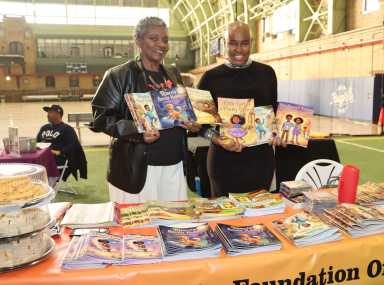 Kamla Millwood, right, with Vincentian author Caren Charles De Freitas, displaying books written by Charles De Freitas and published by Millwood's Palatial Publishing, LLC.