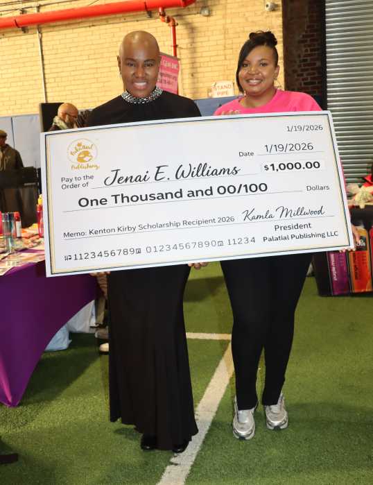 Kamla Millwood, left, displays enlarged $1,000 check for Kenton Kirby Scholarship with inaugural recipient Jenai E. Williams.