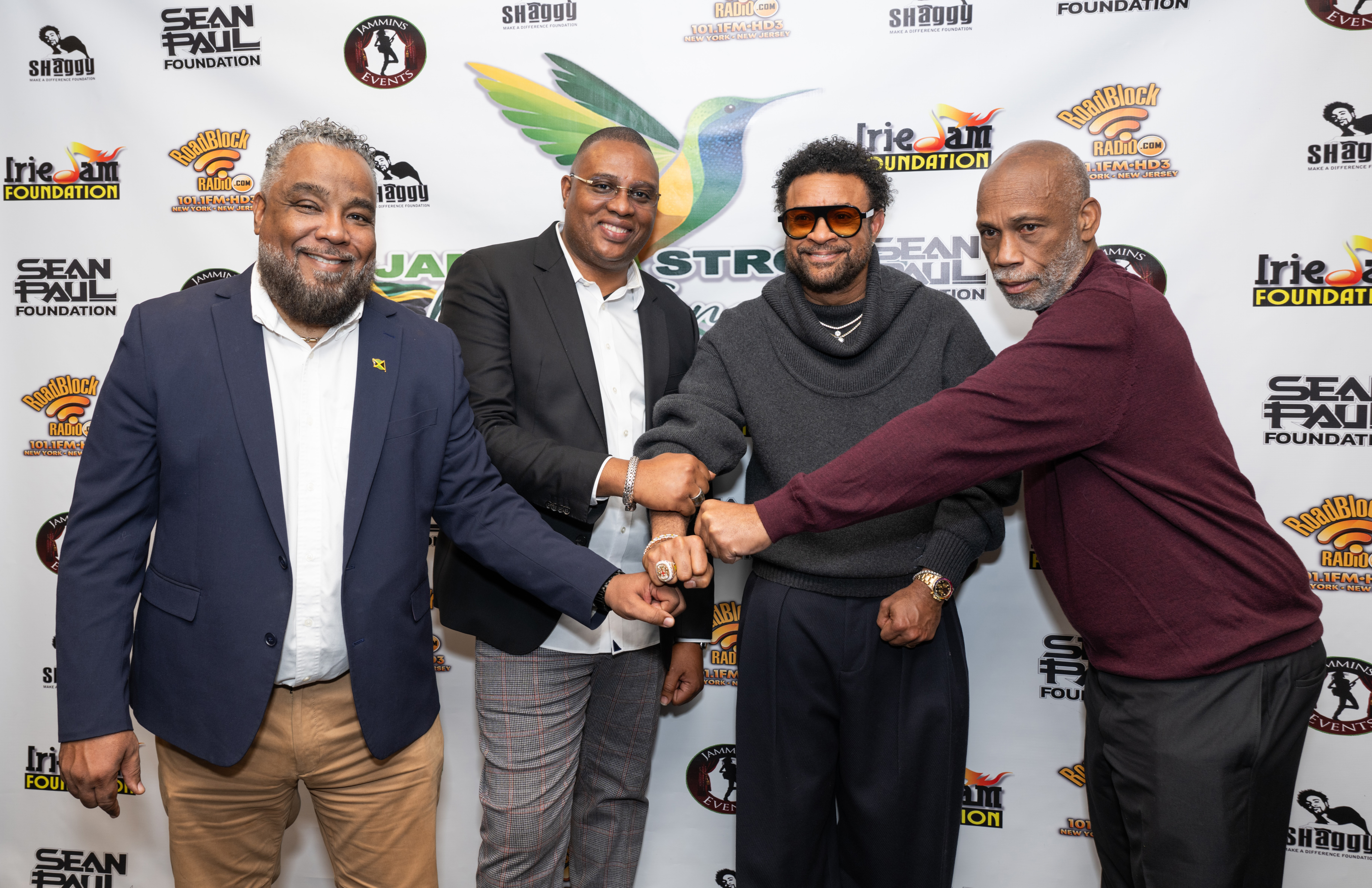 Jamaica Strong Executives (from left) Bobby Clarke, Irie Jam radio; Kacy Rankine, Roadblock radio; and George Crooks (R), Jammins Events share lens time with GRAMMY-winning dancehall/reggae icon Shaggy (3rd from left).