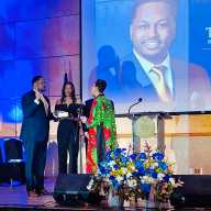 Former Council Speaker Adrienne Adams administers the oath to Council Member Tyrell Hankerson as his mother holds the Bible during the swearing-in ceremony.