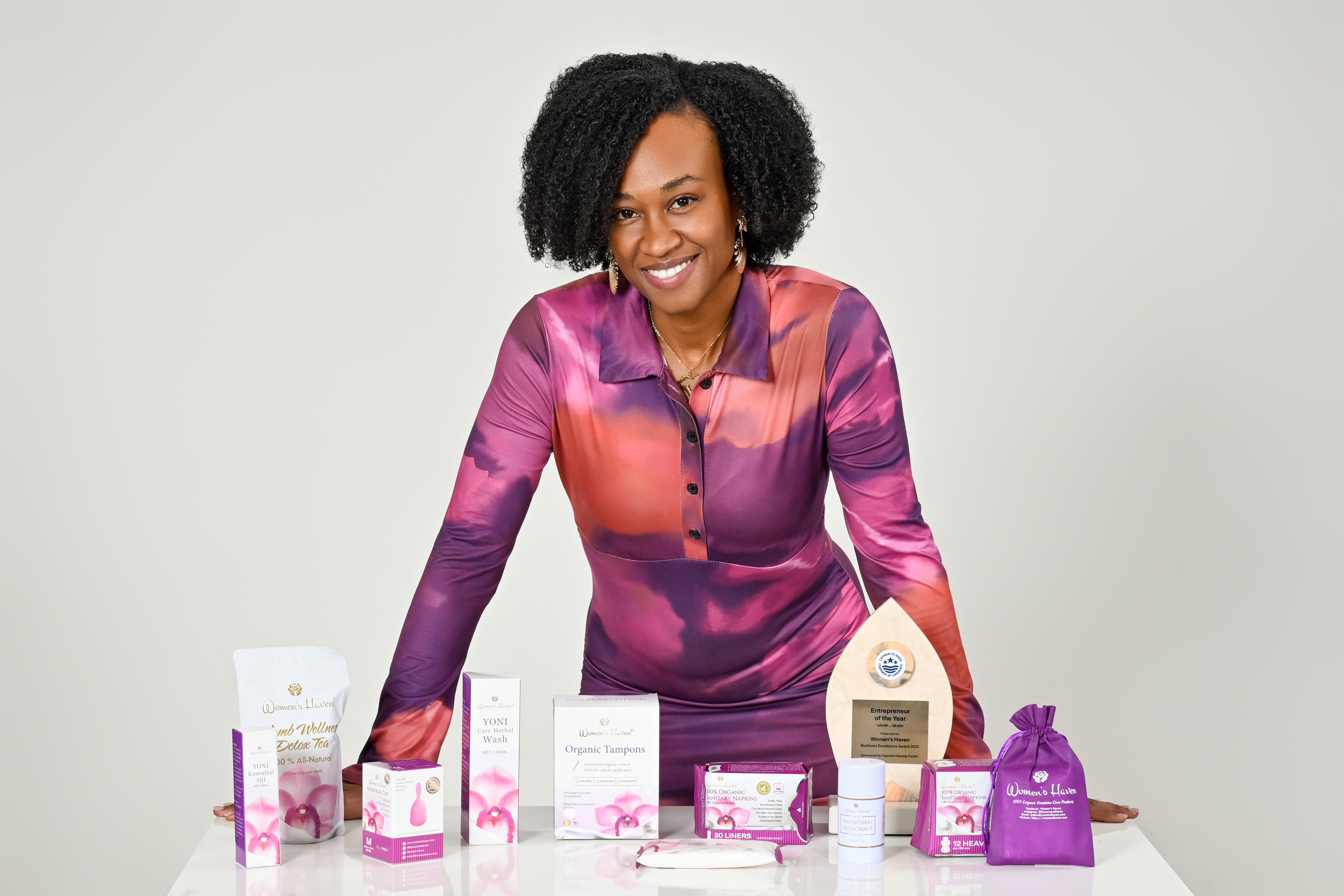 Melesia Adderley, founder and president of Women’s Haven, poses with products from her Caribbean-owned organic feminine care line, now available in 15 countries.