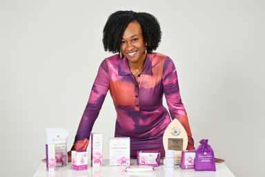 Melesia Adderley, founder and president of Women’s Haven, poses with products from her Caribbean-owned organic feminine care line, now available in 15 countries.