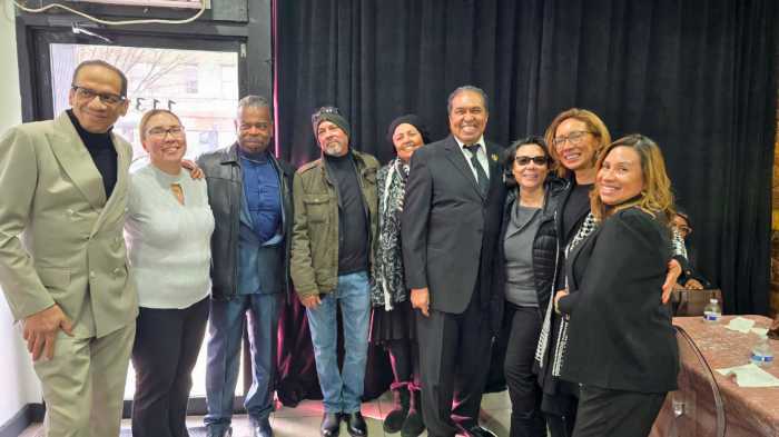 Award-winning fashion designer Roger Gary, left with family members Simone Mitchell, David Frank Dwayne Wong, sister Zandra Smith, brother Brian Smith, Romalia Mitchell, Allison Mitchell and Marcia Mitchell, cousins, after bidding farewell to his 98-year old mother Sybil Teresa Smith on Jan. 28. Her life was celebrated with a Communion Service at St. Francis of Assisi-St.Blaise, 1081 Nostrand Ave. in Brooklyn.