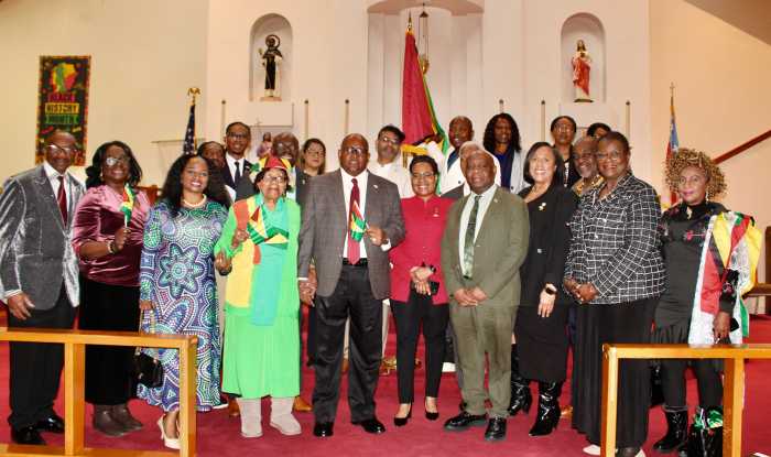 Consul General of Guyana to NY, Michael E. Brotherson, fifth from left, Acting Trinidad & Tobago Mary A. Tang Yew, Consul General of Dominica Representative Sheldon Peter Anthony, Assemblywoman Alicia Hyndman (partly hidden) President of Queens College Alumni NY, John Campbell, Senator Roxanne Persaud, Monica Sanchez, and Pastor James Richmond, extreme left, among many others from the diaspora pose in St. Gabriel's Epispocal Church, Brooklyn after a 56th Republic Anniversary Interfaith service on Feb. 22, 2026.