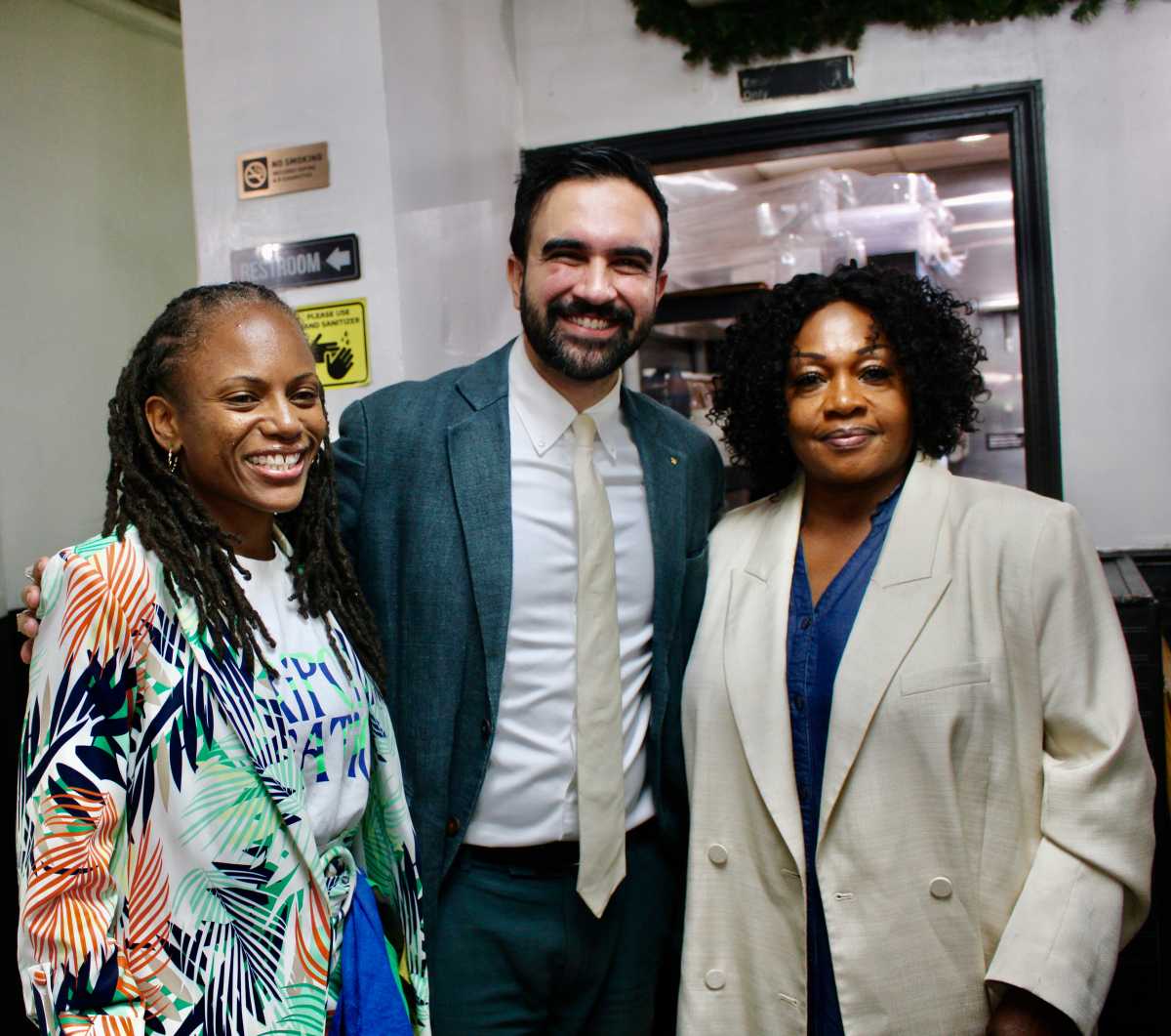 Mayor of the City of New York Zohran K. Mamdani, center, with Assembly Member Monique Chandler-Waterman, left, and owner of the Hills Restaurant Doris Rodney, after a 2025 walkabout in Little Caribbean in Brooklyn.