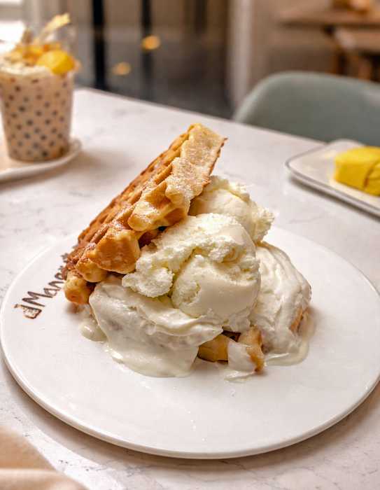Customers visit the Astoria Mango Mango café, one of more than 35 locations nationwide, known for popular items such as its waffle ice cream sandwich.