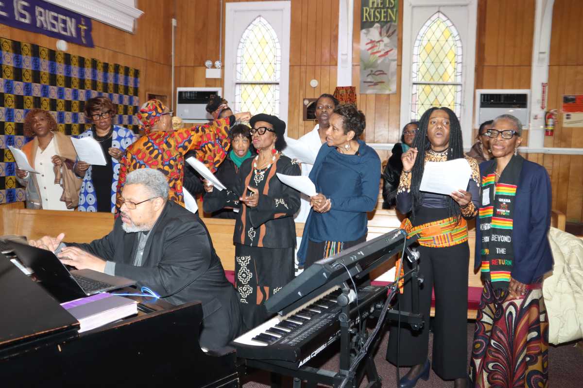 Sis. Joycelyn King leads United Women of Faith at Fenimore Street United Methodist Church, with organist, pianist, keyboardist Joseph Roberts in foreground.