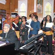 Sis. Joycelyn King leads United Women of Faith at Fenimore Street United Methodist Church, with organist, pianist, keyboardist Joseph Roberts in foreground.