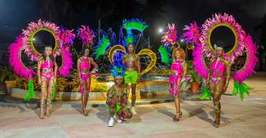 Masqueraders wearing costumes designed by Nelsion Nurse creator of Harmony Band, that will be vying in Guyana's 56th Republic Anniversary Mashramani along the parade route in Georgetown on Feb. 23, 2026.
