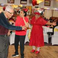 Seniors on the dance floor enjoying Bollywood songs performed by entertainers, during the 5th Annual V-Day hosted by ICF, in collaboration with United Adult Care, at Liberty Palace in Richmond, Queens.