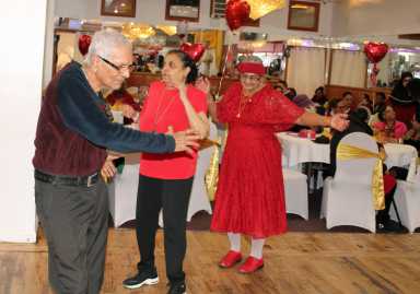 Seniors on the dance floor enjoying Bollywood songs performed by entertainers, during the 5th Annual V-Day hosted by ICF, in collaboration with United Adult Care, at Liberty Palace in Richmond, Queens.