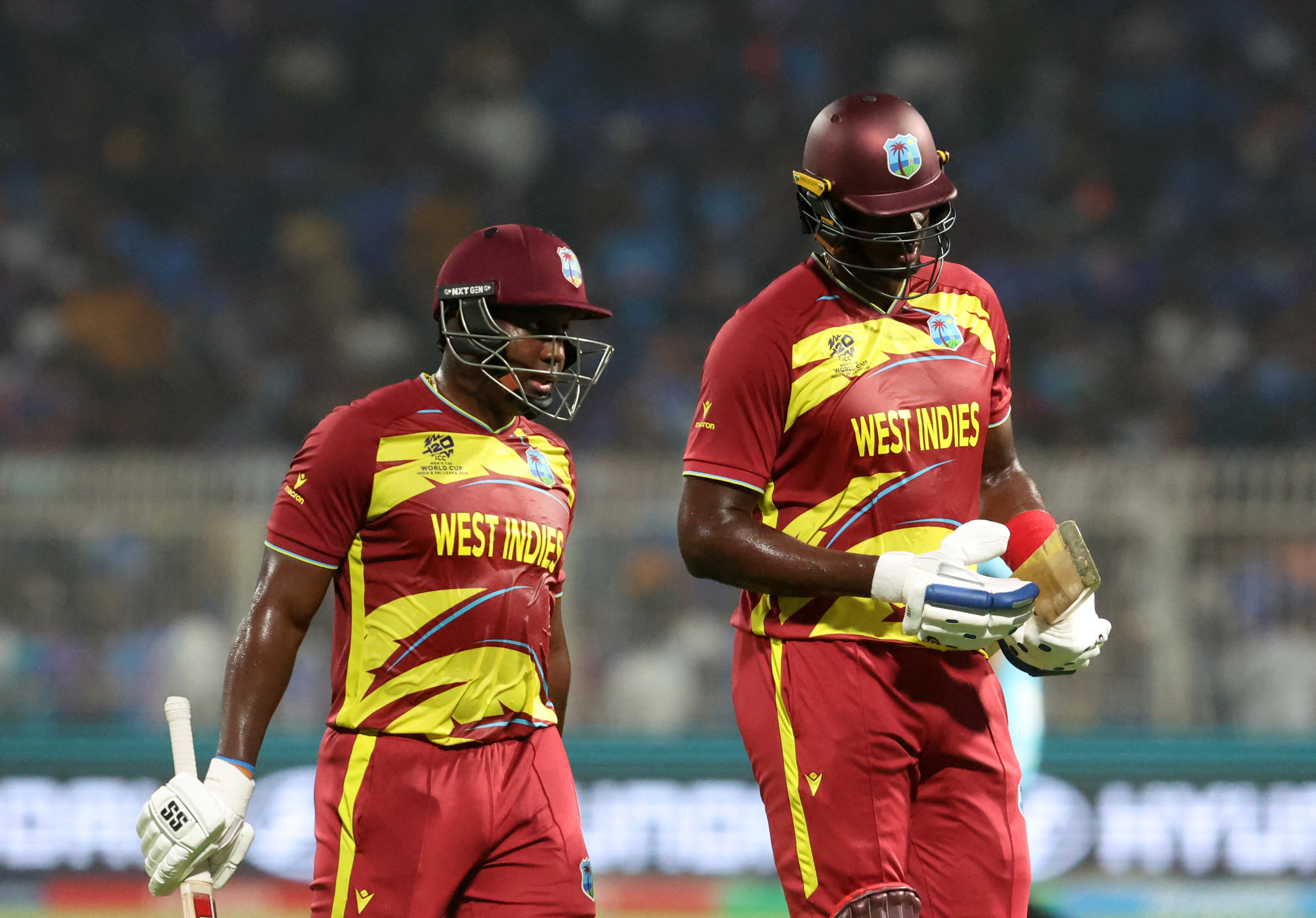 Cricket - ICC Men's T20 World Cup 2026 - Super 8 - India v West Indies - Eden Gardens, Kolkata, India - March 1, 2026 West Indies' Rovman Powell and Jason Holder walk back to the pavilion at the end of the innings.