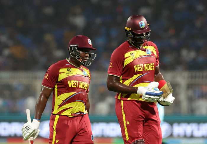 Cricket - ICC Men's T20 World Cup 2026 - Super 8 - India v West Indies - Eden Gardens, Kolkata, India - March 1, 2026 West Indies' Rovman Powell and Jason Holder walk back to the pavilion at the end of the innings.
