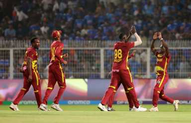 ICC Men's T20 World Cup 2026 - Super 8 - India v West Indies - Eden Gardens, Kolkata, India - March 1, 2026 West Indies' Jason Holder celebrates with teammates after taking the wicket of India's Ishan Kishan.