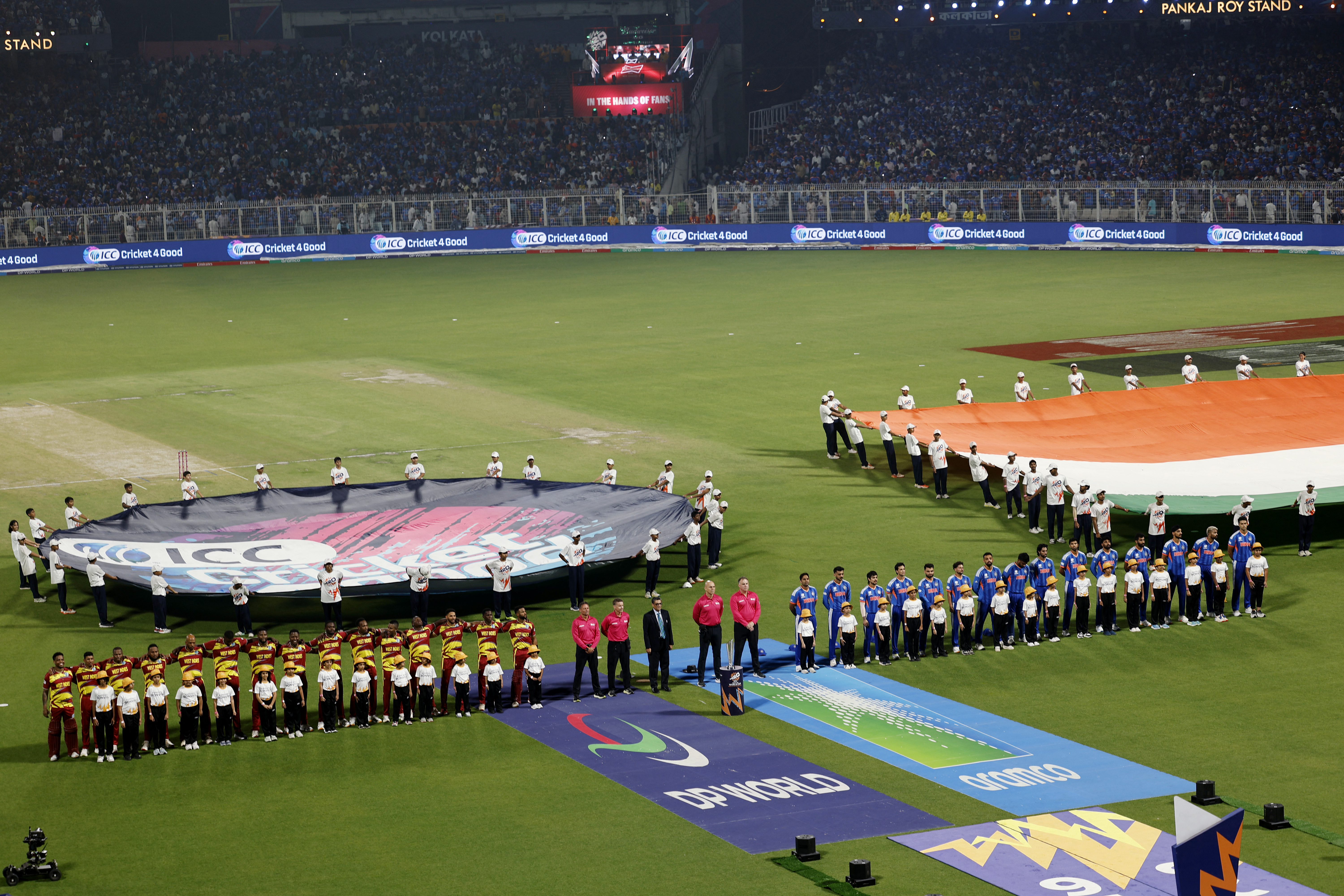 Cricket - ICC Men's T20 World Cup 2026 - Super 8 - India v West Indies - Eden Gardens, Kolkata, India - March 1, 2026 General view as players from both teams line up before the match.
