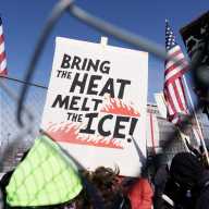 A protesters holds a sign outside the Whipple Federal Building during a demonstration against ongoing Immigration and Customs Enforcement (ICE) operations, in Fort Snelling, Minnesota, U.S., March 1, 2026.