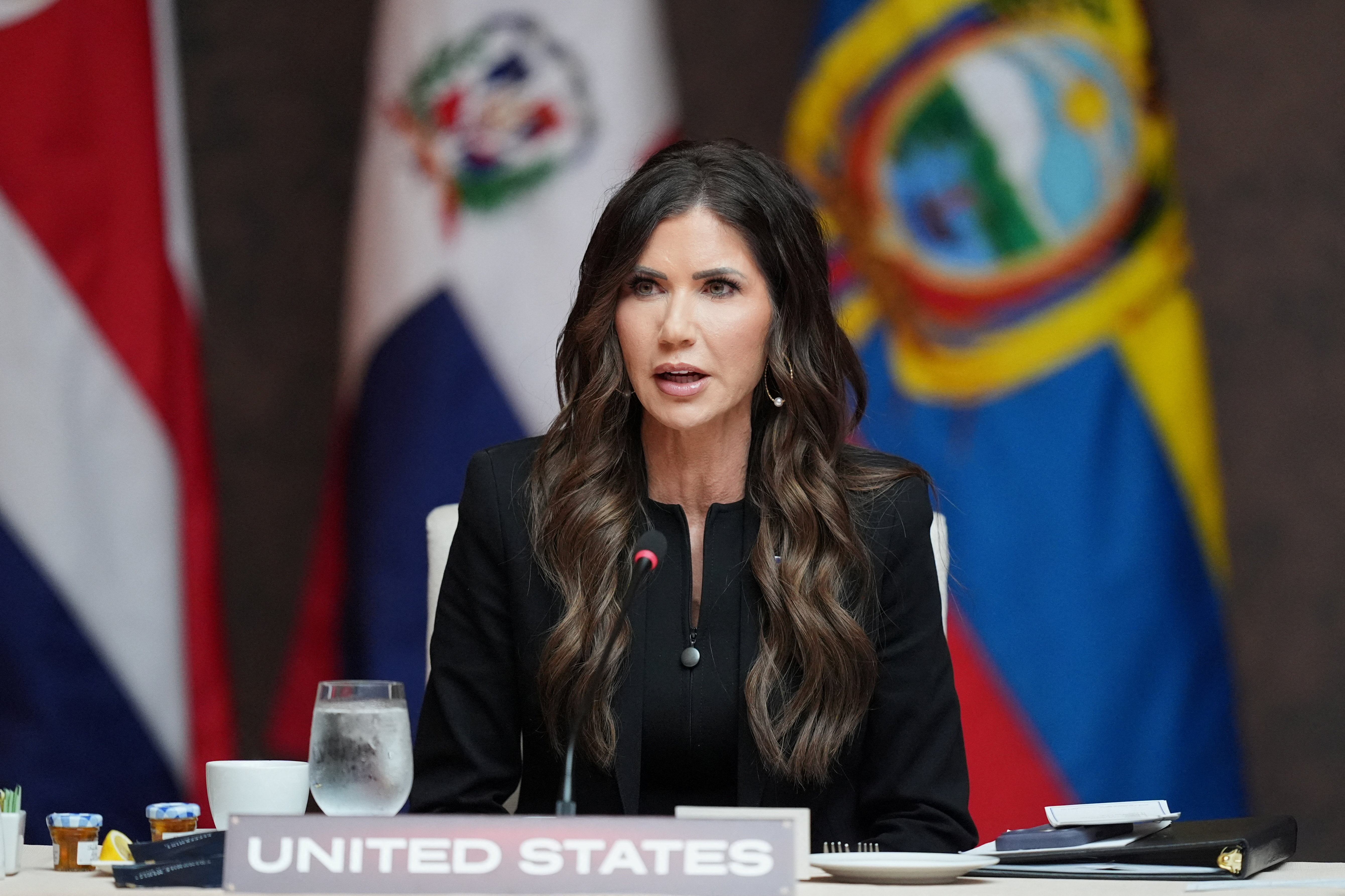 Kristi Noem delivers remarks at a working lunch at the Shield of the Americas Summit at Trump National Doral Miami, in Doral, Florida, U.S., March 7, 2026.