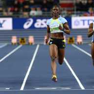 Saint Lucia's Julien Alfred crosses the line to win heat 4 of the women's 60m at the World Indoor Championships - Kujawsko-Pomorska Arena, Torun, Poland - March 21, 2026.