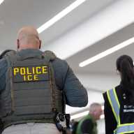 United States Immigration and Customs Enforcement (ICE) agents are present as passengers wait in line at a Transportation Security Administration (TSA) checkpoint after hundreds of Immigration and Customs Enforcement agents were ordered to deploy to airports to help fill TSA staffing gaps, at Hartsfield-Jackson Atlanta International Airport in Atlanta, Georgia, U.S. March 23, 2026.