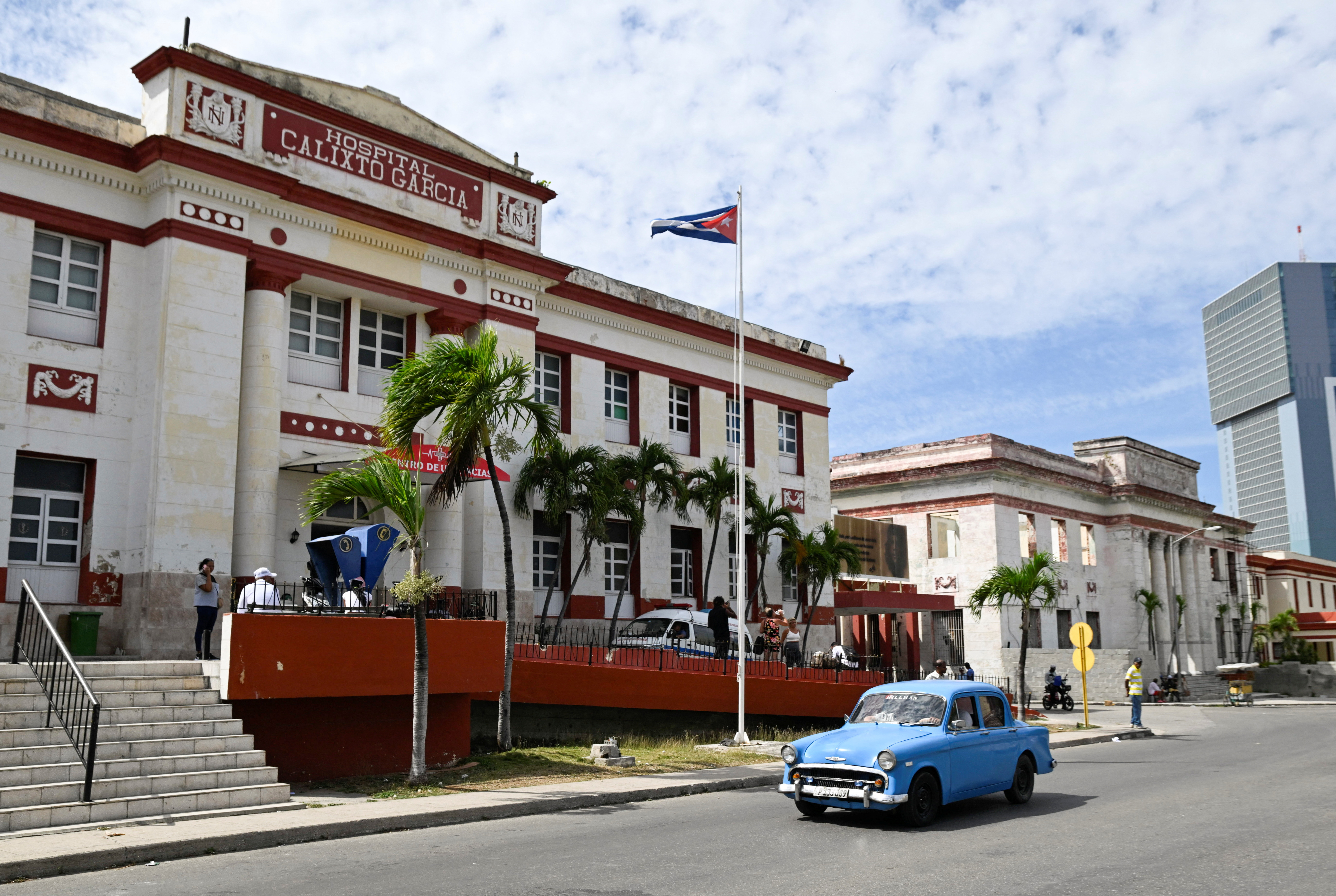 A vintage car passes by the Calixto Garcia hospital as Cuba’s once-vaunted healthcare system, long hailed as a cornerstone of the 1959 revolution, has deteriorated amid years of economic crisis and U.S. sanctions, a decline that has accelerated this year with U.S. restrictions on oil supplies, in Havana, Cuba, March 24, 2026.
