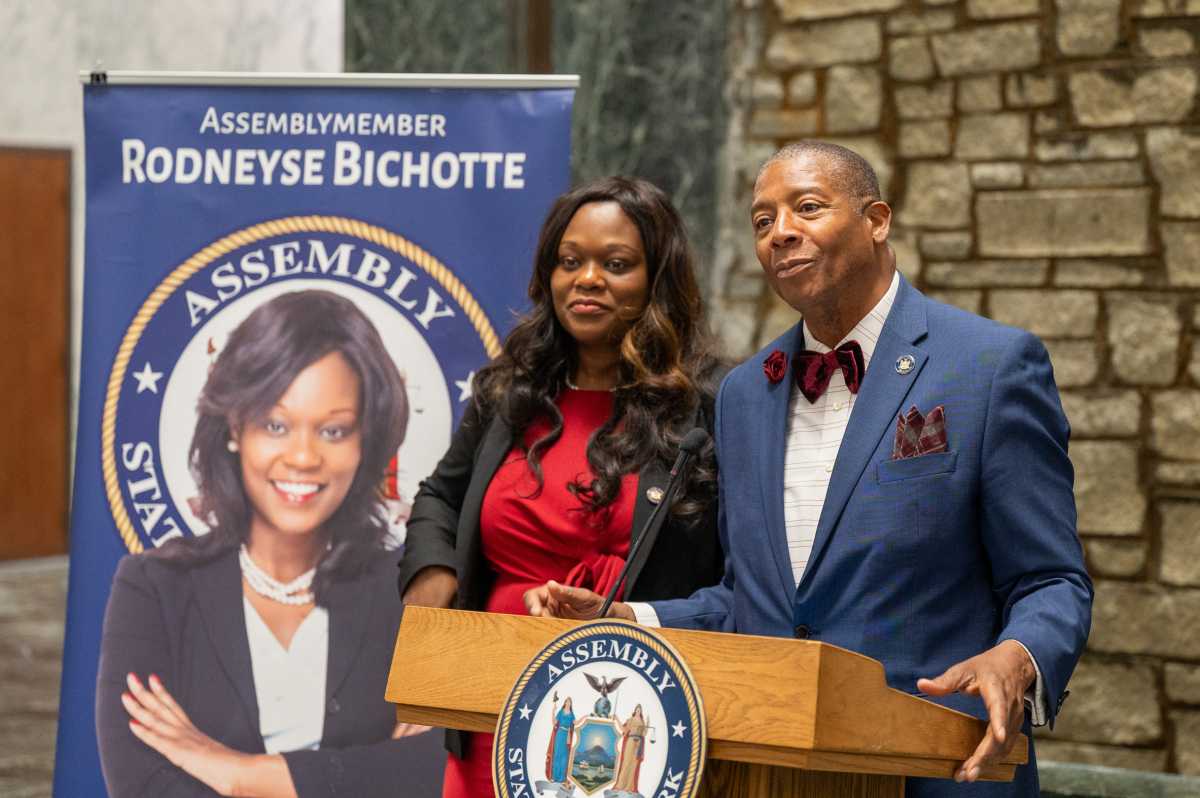 New York State Senator James Sanders, Jr., speaks alongside Assemblymember Rodneyse Bichotte Hermelyn.