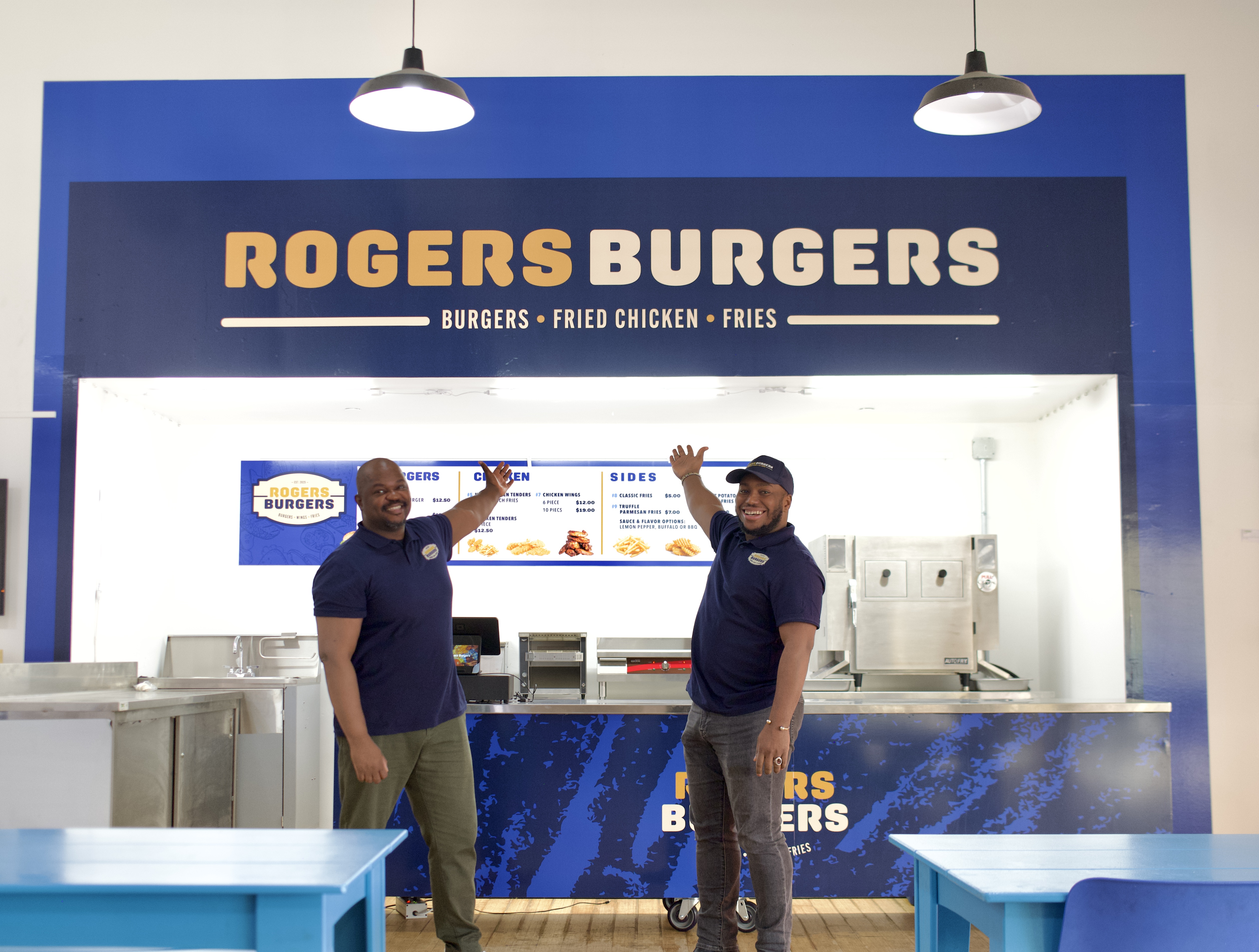 Josue Pierre, district leader and co-founder of Rogers Burgers (left) with Jonathan Pierre Lafleur, executive director of Atelier Artist and co-founder of Rogers Burgers.