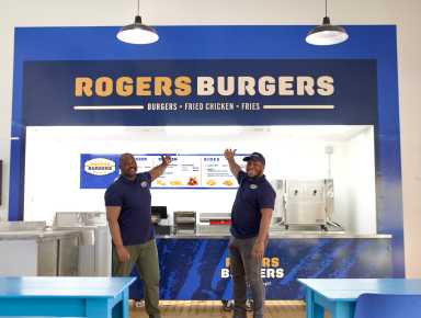 Josue Pierre, district leader and co-founder of Rogers Burgers (left) with Jonathan Pierre Lafleur, executive director of Atelier Artist and co-founder of Rogers Burgers.