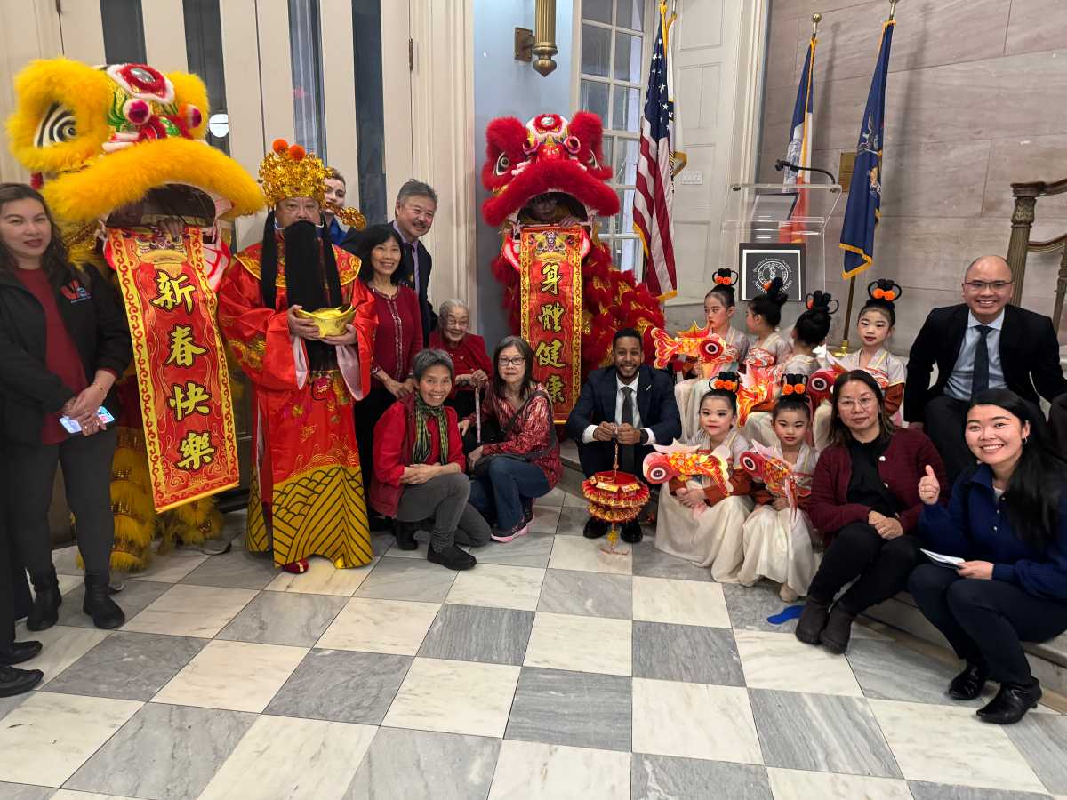 Borough President Reynoso, Lion Dancers, and members of the public.