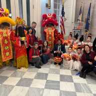 Borough President Reynoso, Lion Dancers, and members of the public.