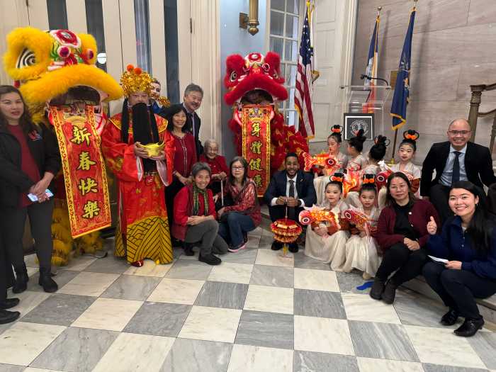 Borough President Reynoso, Lion Dancers, and members of the public.